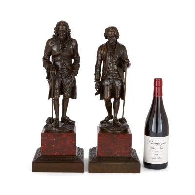 Pair of French patinated bronze sculptures of Voltaire and Rousseau