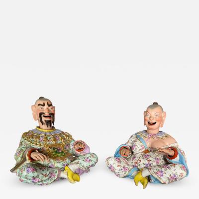 Pair of German Chinoiserie Porcelain Figures of Seated Nodders 
