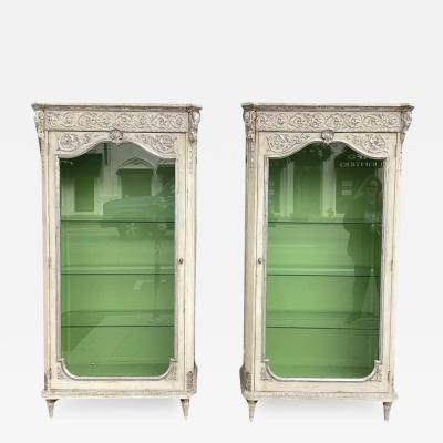 Pair of Hollywood Regency Silver Giltwood Paint Decorated Display Cabinets