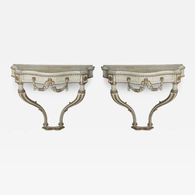 Pair of Italian Cream Painted Parcel Gilt and Carved Wall Mounted Console Tables