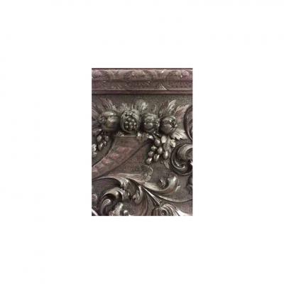 Pair of Italian Renaissance style carved walnut wall plaques with cupid head
