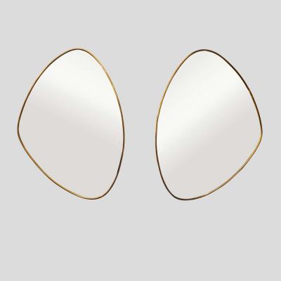 Pair of Italian design brass frame asymmetrical mirrors