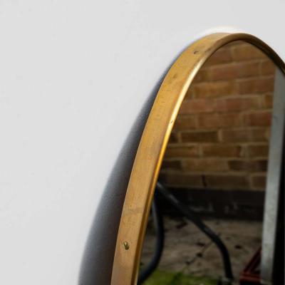 Pair of Italian design brass frame asymmetrical mirrors