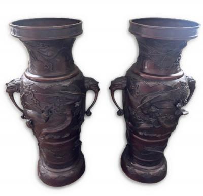 Pair of Japanese tall bronze floor vases with handles and bird relief
