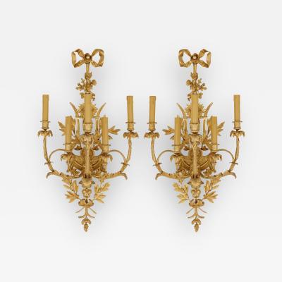 Pair of Louis XVI style gilt bronze sconces