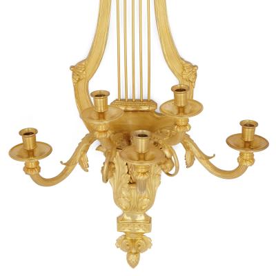 Pair of Louis XVI style gilt bronze sconces