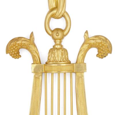 Pair of Louis XVI style gilt bronze sconces
