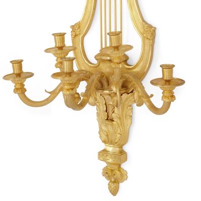 Pair of Louis XVI style gilt bronze sconces