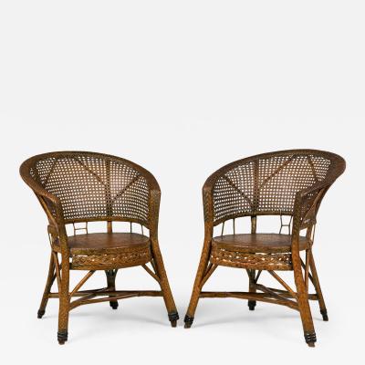 Pair of Mid Century American Wicker Cane Pull Up Armchairs