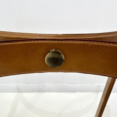 Pair of Mid Century Modern side tables in the style of Jacques Adnet 