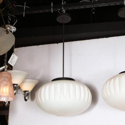 Pair of Mid Century White Frosted Oval Chandeliers with Black Enamel Chrome Rods