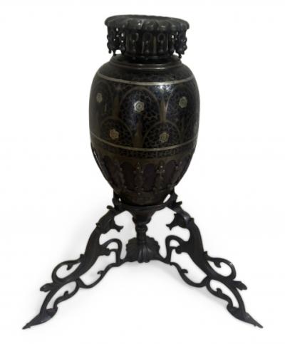 Pair of Middle Eastern candlesticks with brass inlay and 3 horse base