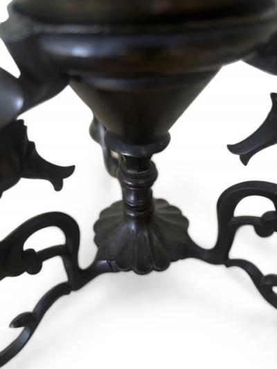 Pair of Middle Eastern candlesticks with brass inlay and 3 horse base