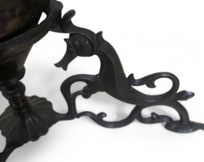 Pair of Middle Eastern candlesticks with brass inlay and 3 horse base