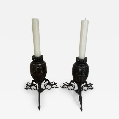 Pair of Middle Eastern candlesticks with brass inlay and 3 horse base