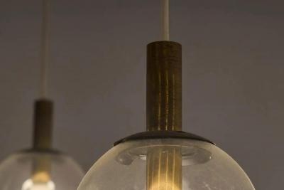 Pair of Monumental Mid Century Chandeliers in Glass Metal and Patinated Brass