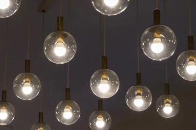 Pair of Monumental Mid Century Chandeliers in Glass Metal and Patinated Brass
