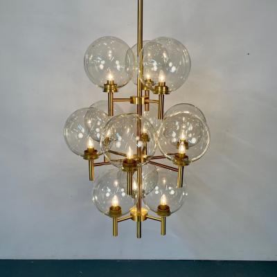 Pair of Monumental Mid Century Modern Style Chandeliers in Amber Glass and Brass