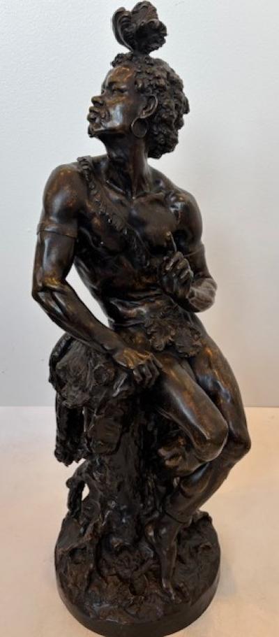 Pair of Moreau French Victorian bronze seated nubian figures with feathers in ha