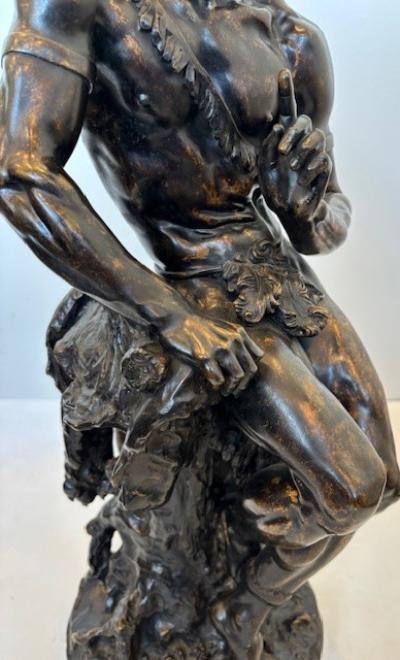 Pair of Moreau French Victorian bronze seated nubian figures with feathers in ha