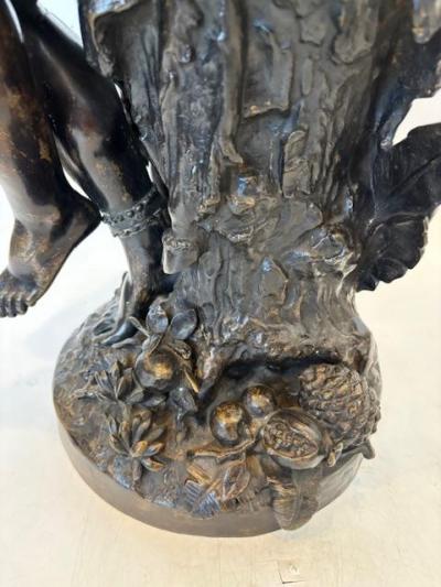Pair of Moreau French Victorian bronze seated nubian figures with feathers in ha