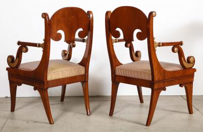 Pair of Russian Neoclassical Parcel Gilt Mahogany Armchairs
