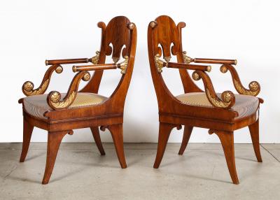 Pair of Russian Neoclassical Parcel Gilt Mahogany Armchairs