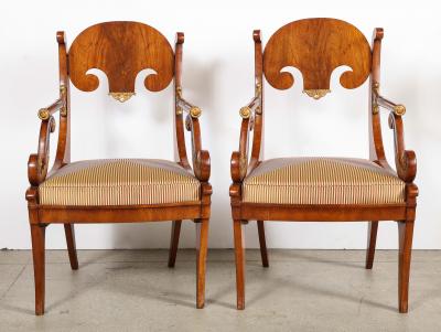 Pair of Russian Neoclassical Parcel Gilt Mahogany Armchairs