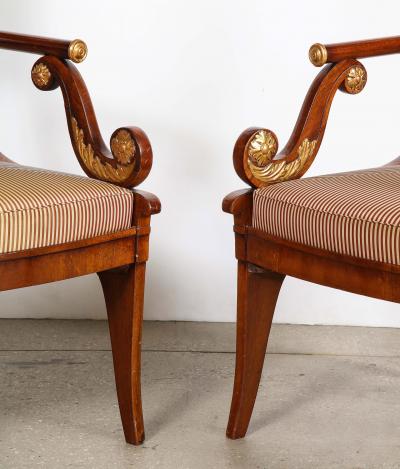 Pair of Russian Neoclassical Parcel Gilt Mahogany Armchairs