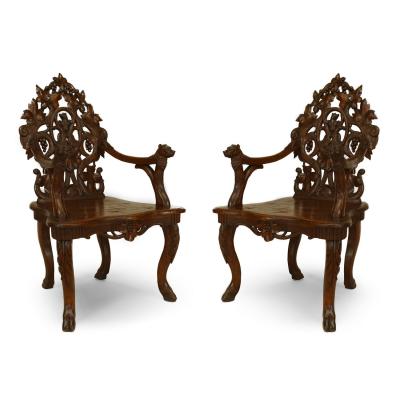 Pair of Rustic Black Forest Carved Walnut Armchairs