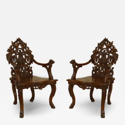 Pair of Rustic Black Forest Carved Walnut Armchairs