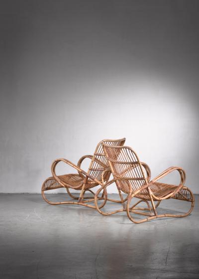 Pair of Scandinavian Modern rattan lounge chairs