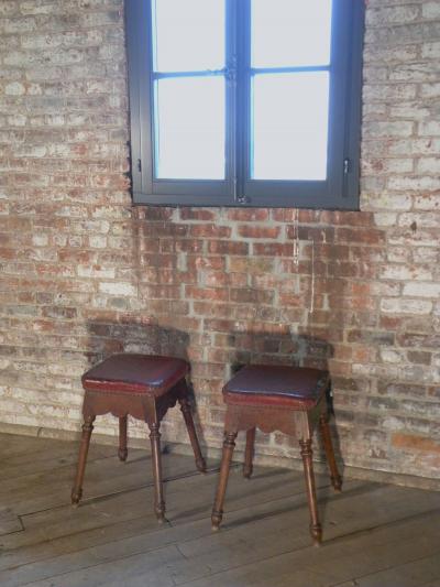 Pair of Spanish square upholstered Baroque oak stools
