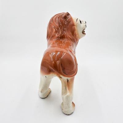 Pair of Staffordshire Striding Lions