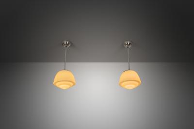 Pair of Stepped Opal Glass Pendant Lamps with Metal Frame Europe 1940s