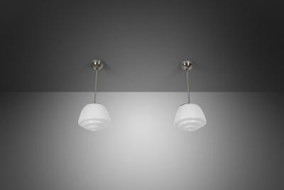Pair of Stepped Opal Glass Pendant Lamps with Metal Frame Europe 1940s