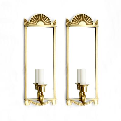 Pair of Swedish Grace era polished brass mirrored sconces 