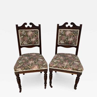 Pair of Victorian Parlor chairs with casters on front legs