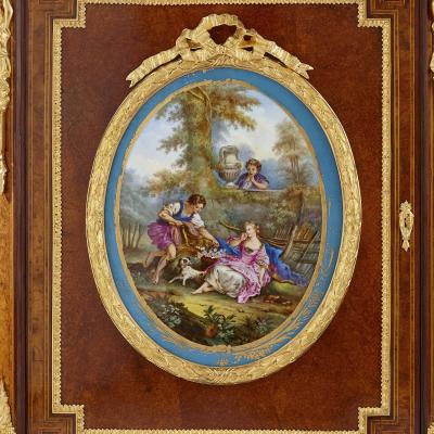 Pair of Victorian period amboyna cabinets with S vres style porcelain plaques