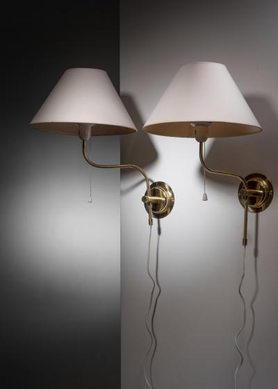 Pair of adjustable brass wall lamps