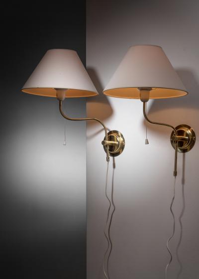 Pair of adjustable brass wall lamps