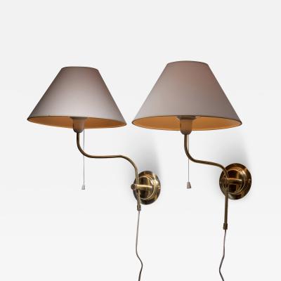 Pair of adjustable brass wall lamps