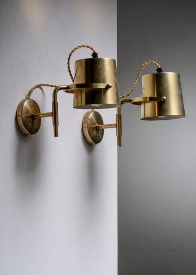 Pair of adjustable brass wall lamps