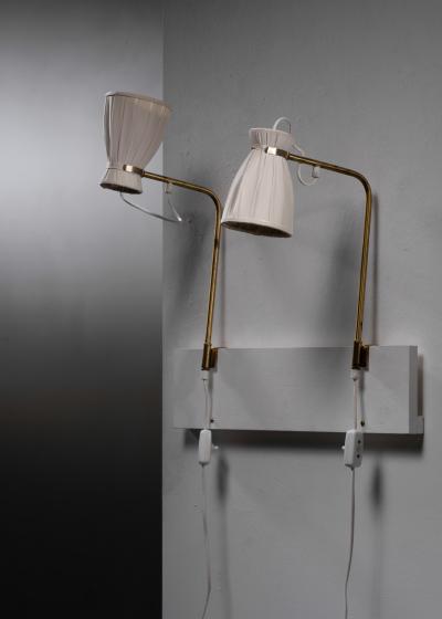 Pair of adjustable wall lamps