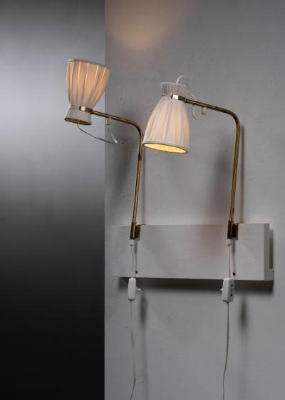 Pair of adjustable wall lamps