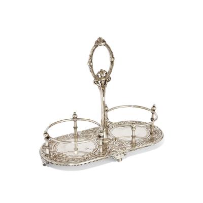 Pair of antique English cut glass decanters with silver plated stand