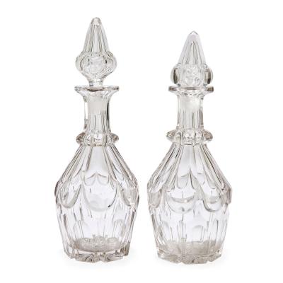Pair of antique English cut glass decanters with silver plated stand
