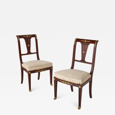 Pair of antique French Empire style mahogany and gilt bronze chairs