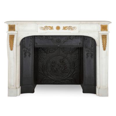 Pair of antique French ormolu mounted marble fireplaces with cast iron insets