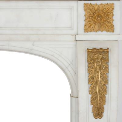 Pair of antique French ormolu mounted marble fireplaces with cast iron insets